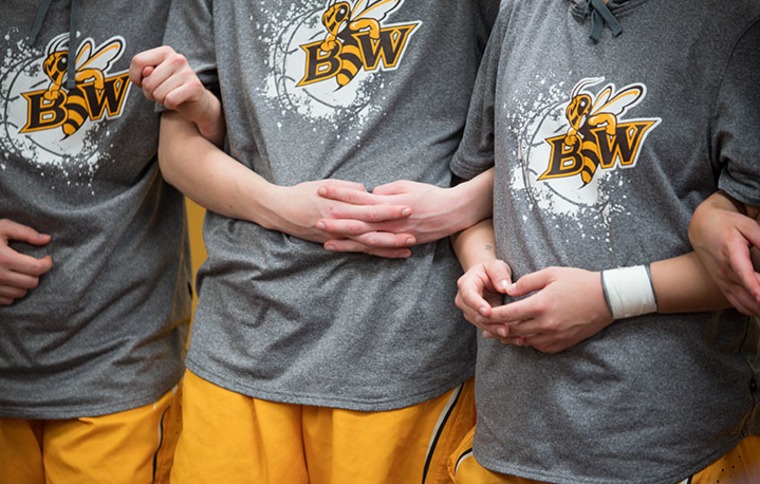 players linking arms at BW boys basketball camp